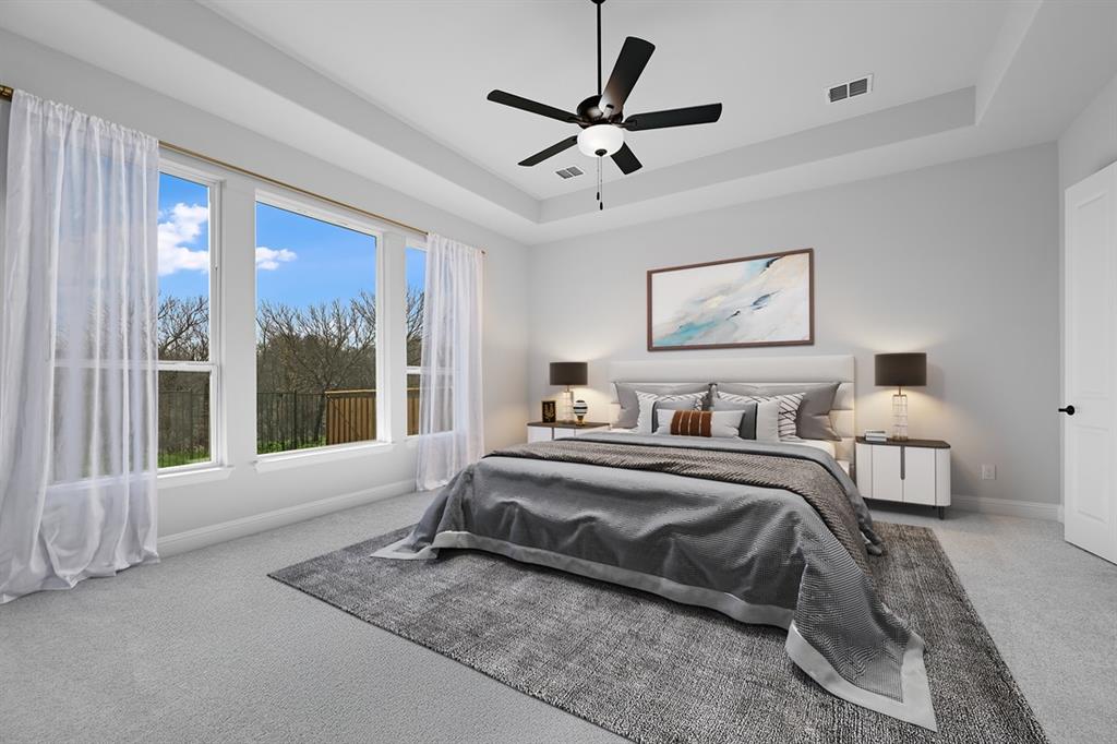 1612 Yellow Rose Road Celina, TX 75009 - Photo 10 of 40 a spacious bedroom with a bed and a large window