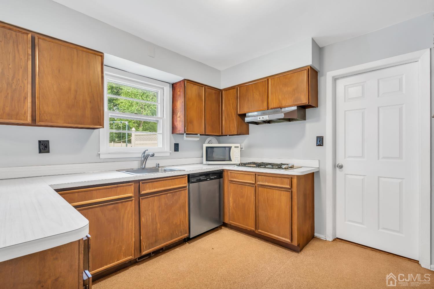 2 Greenwich Road Edison, NJ 08820 - Photo 11 of 31 a kitchen with stainless steel appliances granite countertop a sink stove and refrigerator