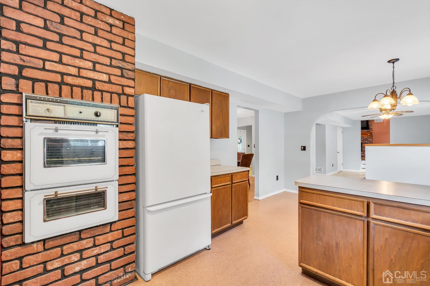 2 Greenwich Road Edison, NJ 08820 - Photo 14 of 31 a kitchen with stainless steel appliances a refrigerator and a stove top oven