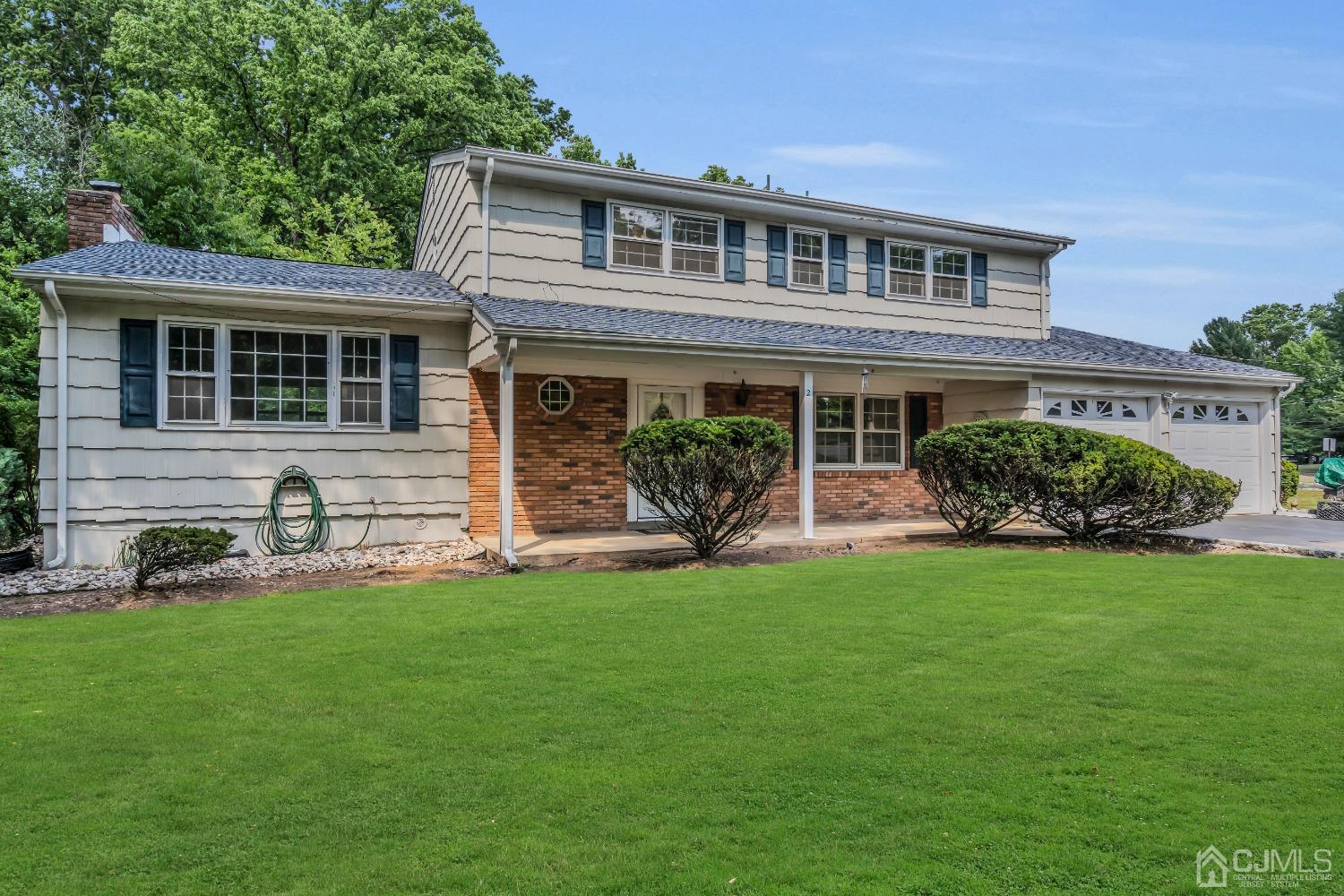 2 Greenwich Road Edison, NJ 08820 - Photo 2 of 31 a front view of a house with a garden