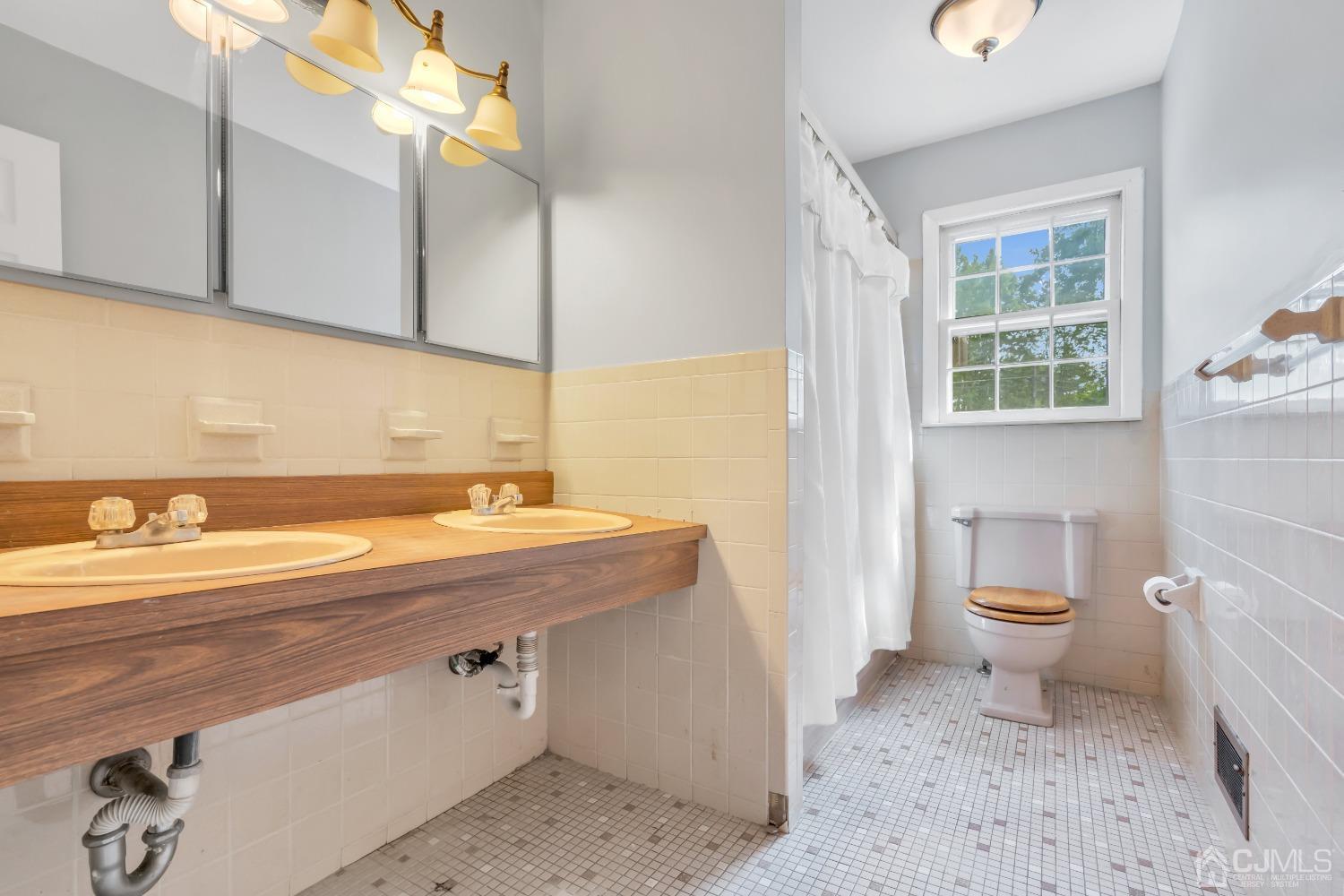 2 Greenwich Road Edison, NJ 08820 - Photo 24 of 31 a bathroom with a sink a toilet and a window