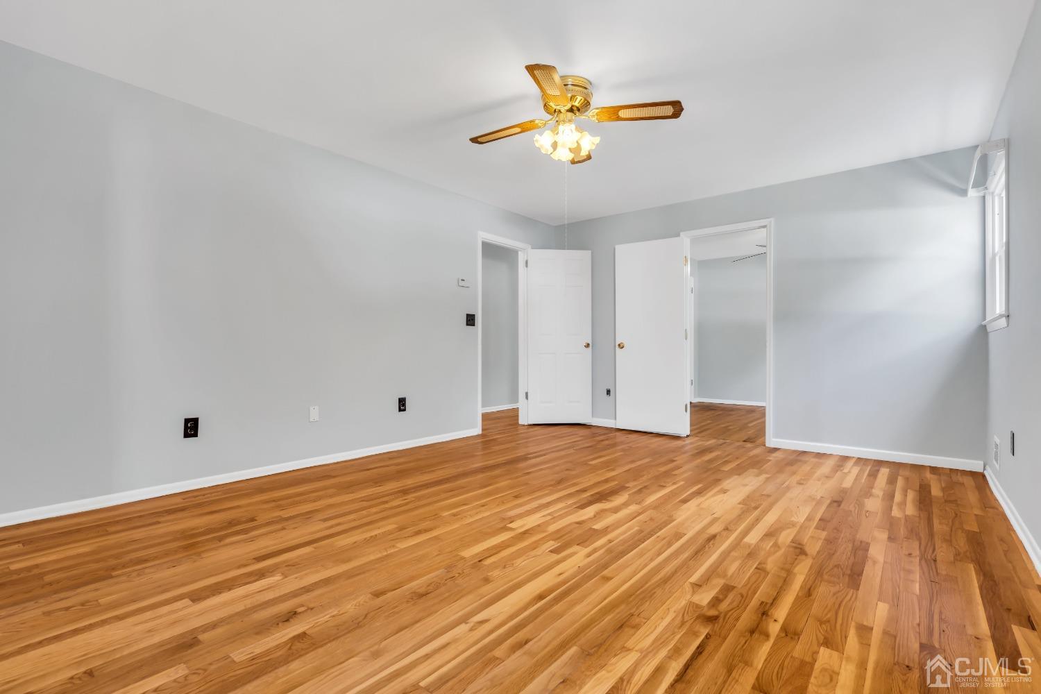 2 Greenwich Road Edison, NJ 08820 - Photo 27 of 31 a view of empty room with wooden floor and fan