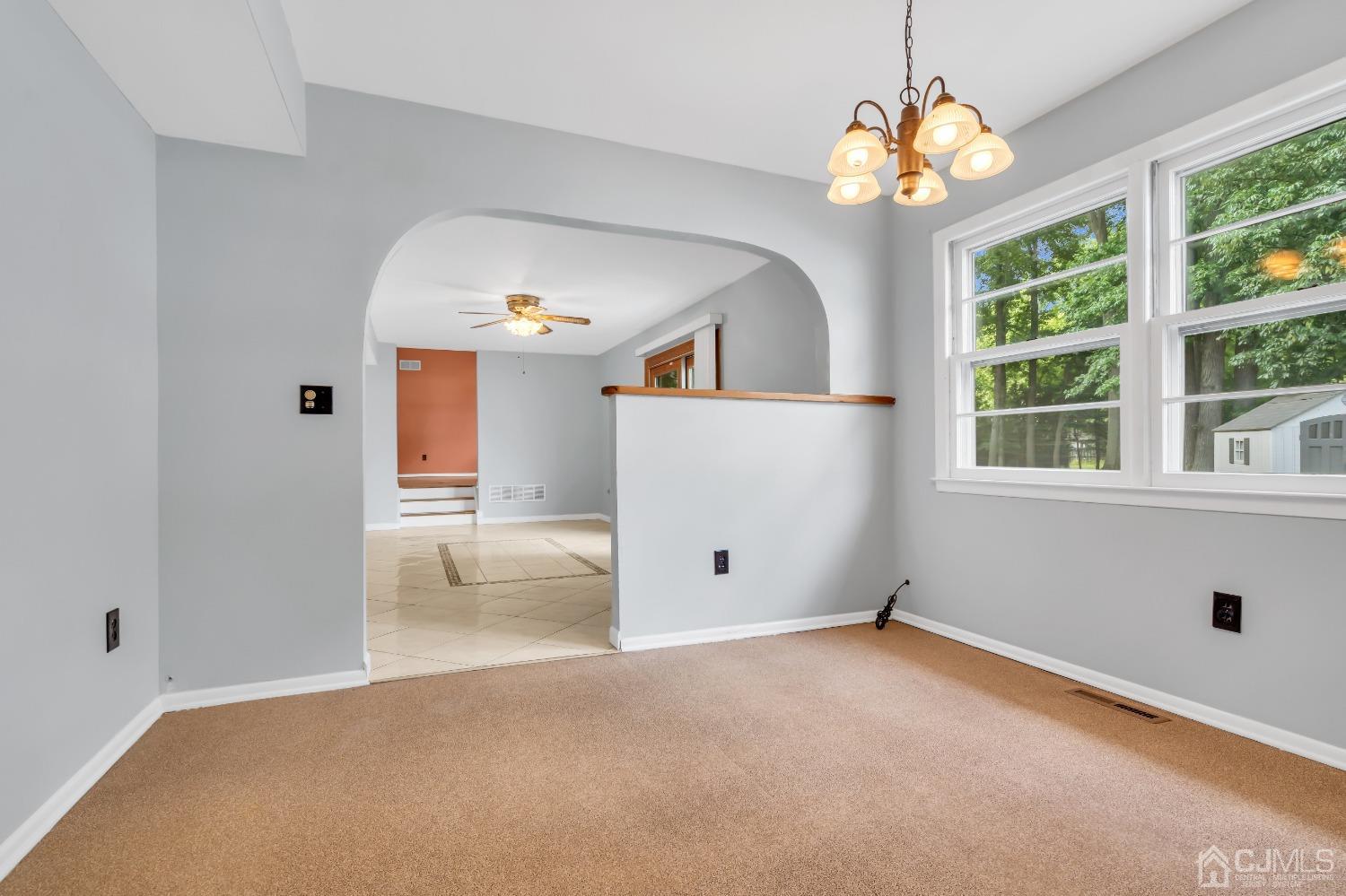 2 Greenwich Road Edison, NJ 08820 - Photo 10 of 31 en empty room with windows and ceiling fan