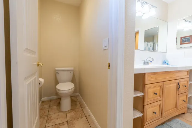 a bathroom with a sink toilet and vanity