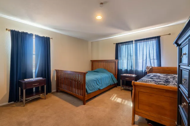 a bedroom with a bed and a cabinets