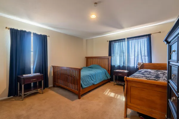 a bedroom with a bed and a cabinets