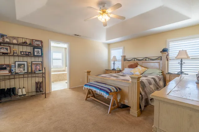 a bedroom with a bed and a book shelf