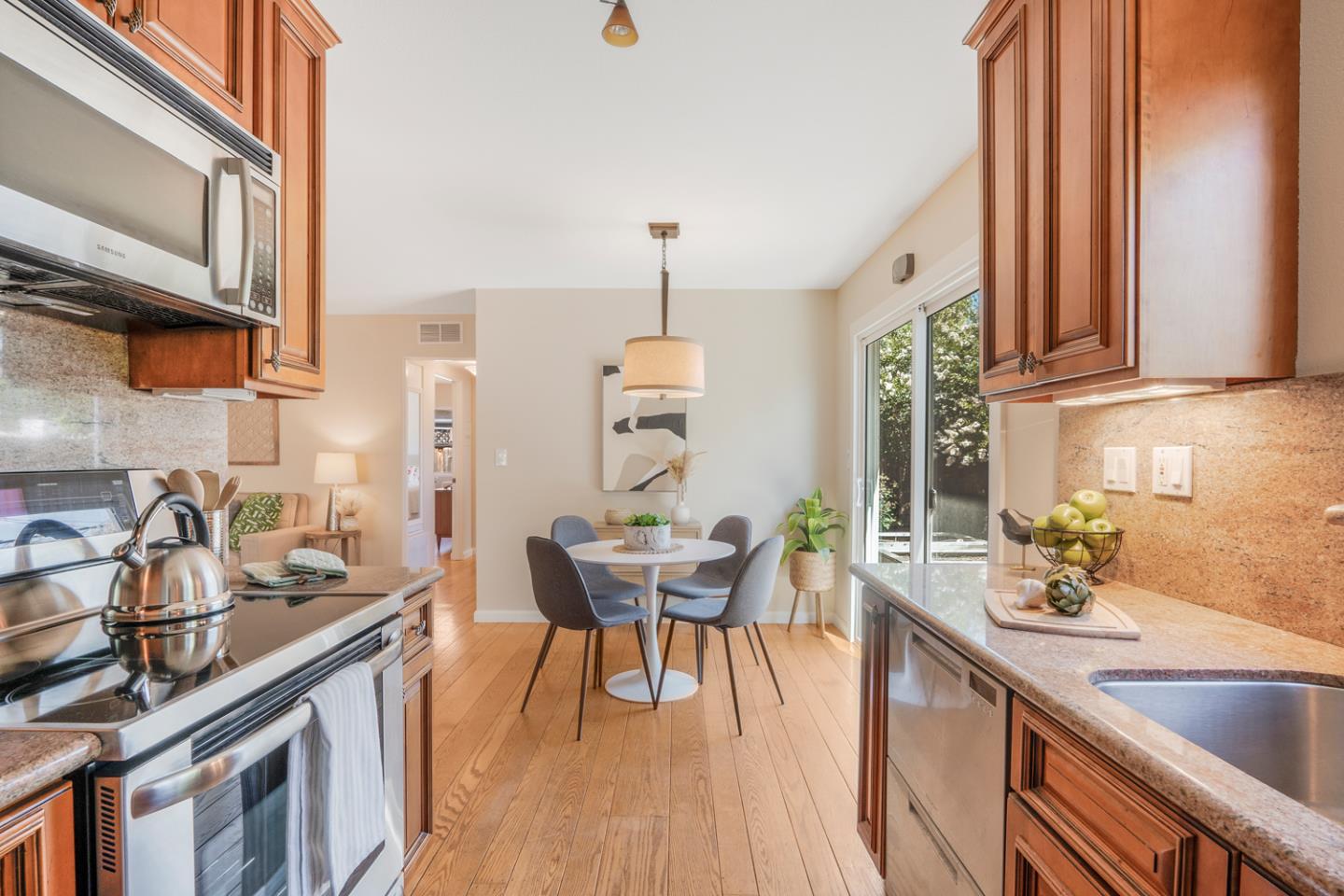 2486 Whitney Drive Mountain View, CA 94043 - Photo 12 of 43 a kitchen with a sink stove and microwave