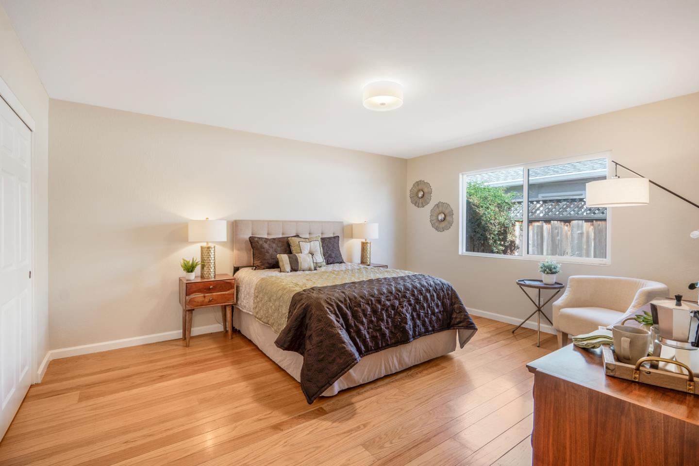 2486 Whitney Drive Mountain View, CA 94043 - Photo 15 of 43 a bedroom with a bed and wooden floor