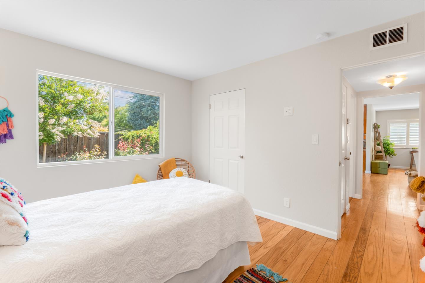 2486 Whitney Drive Mountain View, CA 94043 - Photo 19 of 43 a bedroom with a bed and wooden floor