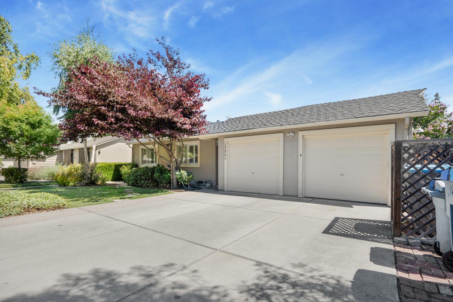 2486 Whitney Drive Mountain View, CA 94043 - Photo 27 of 43 a front view of a house with a yard and garage