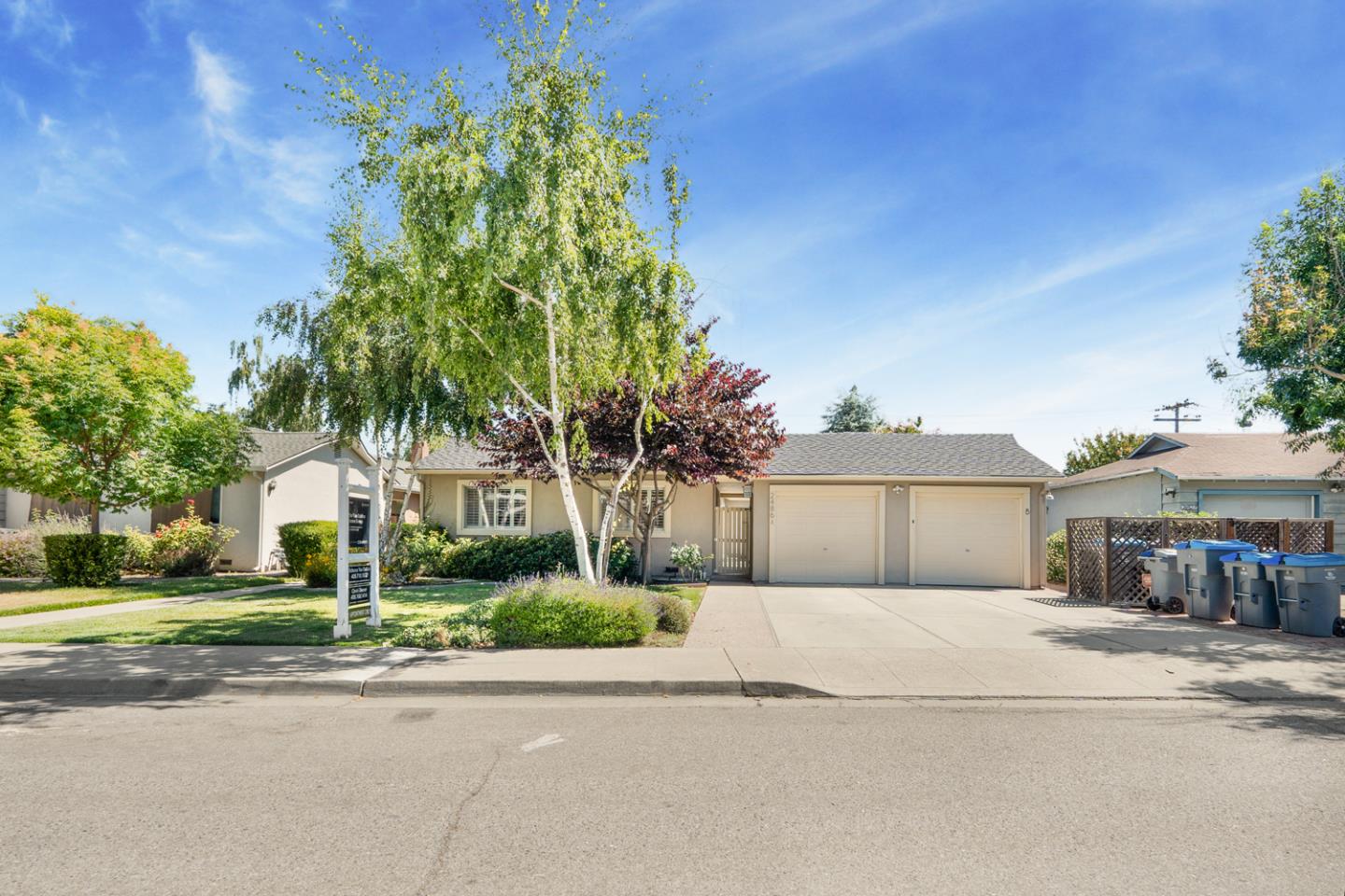 2486 Whitney Drive Mountain View, CA 94043 - Photo 28 of 43 a front view of a house with a garden and trees