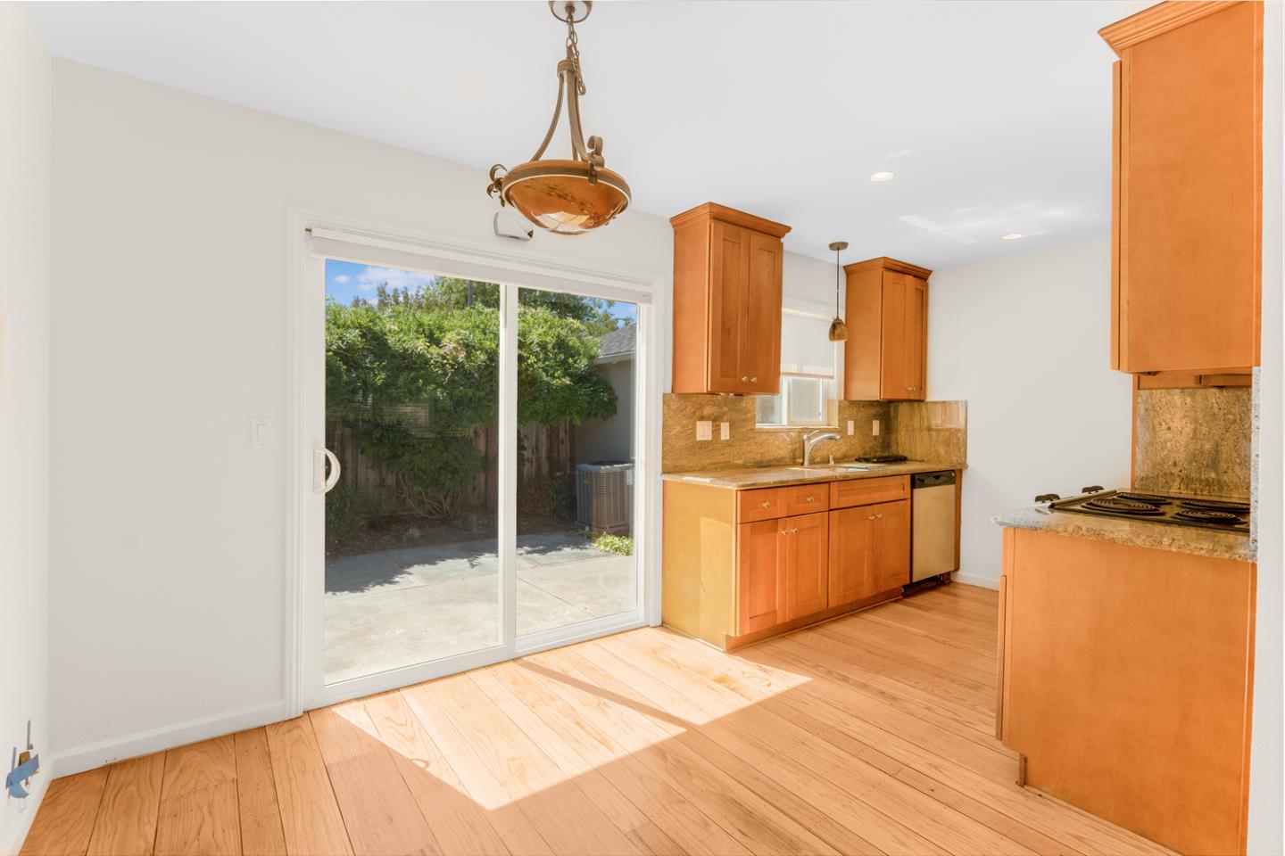 2486 Whitney Drive Mountain View, CA 94043 - Photo 33 of 43 a open kitchen with a large window and stainless steel appliances