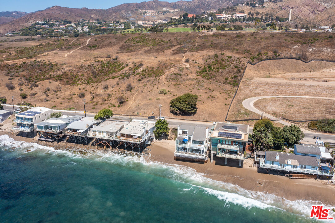 24208 Malibu Road Malibu, CA 90265 - Photo 16 of 16 a view of multiple houses with outdoor space and lake view