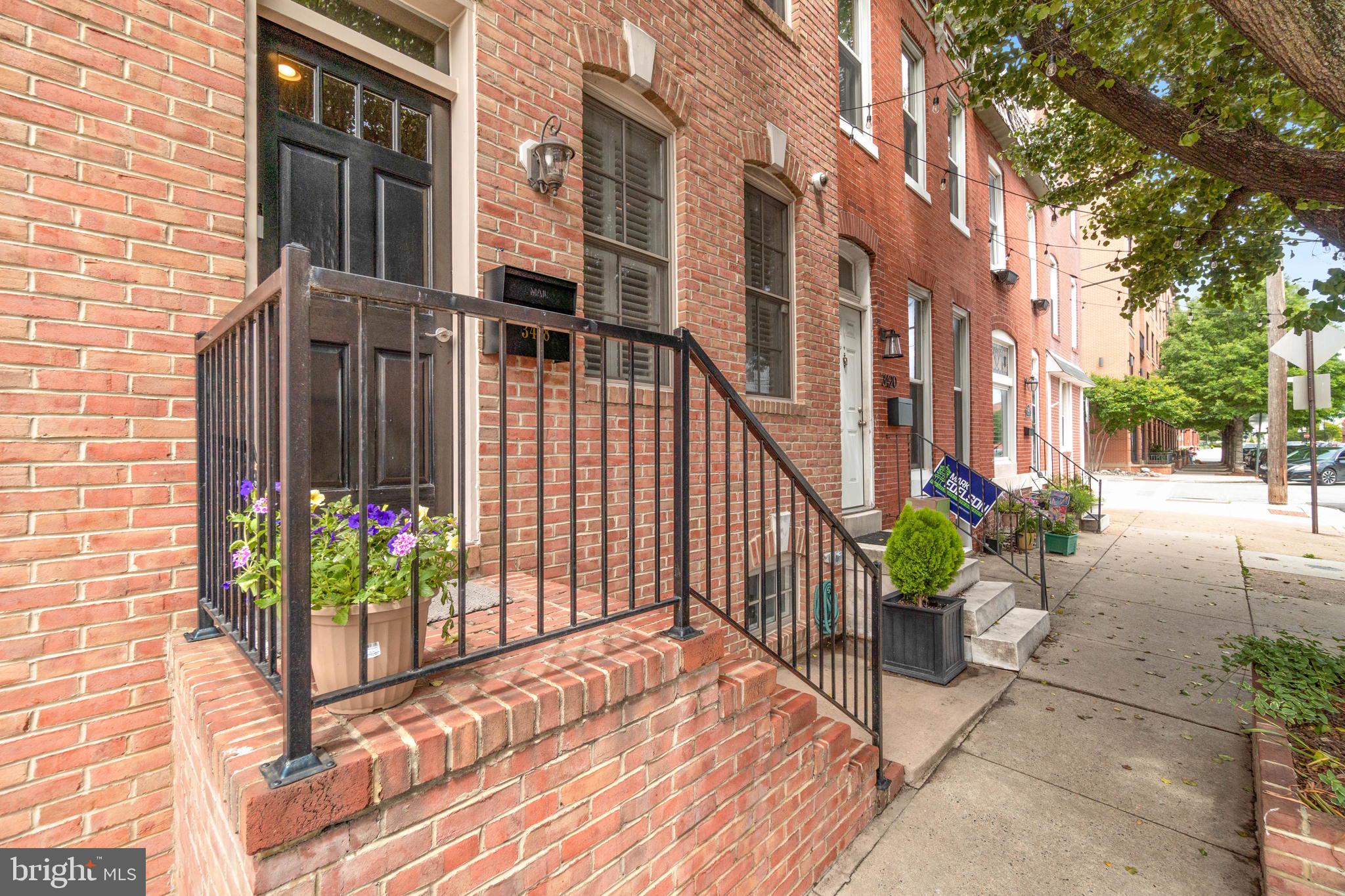 Front exterior on tree lined Canton street