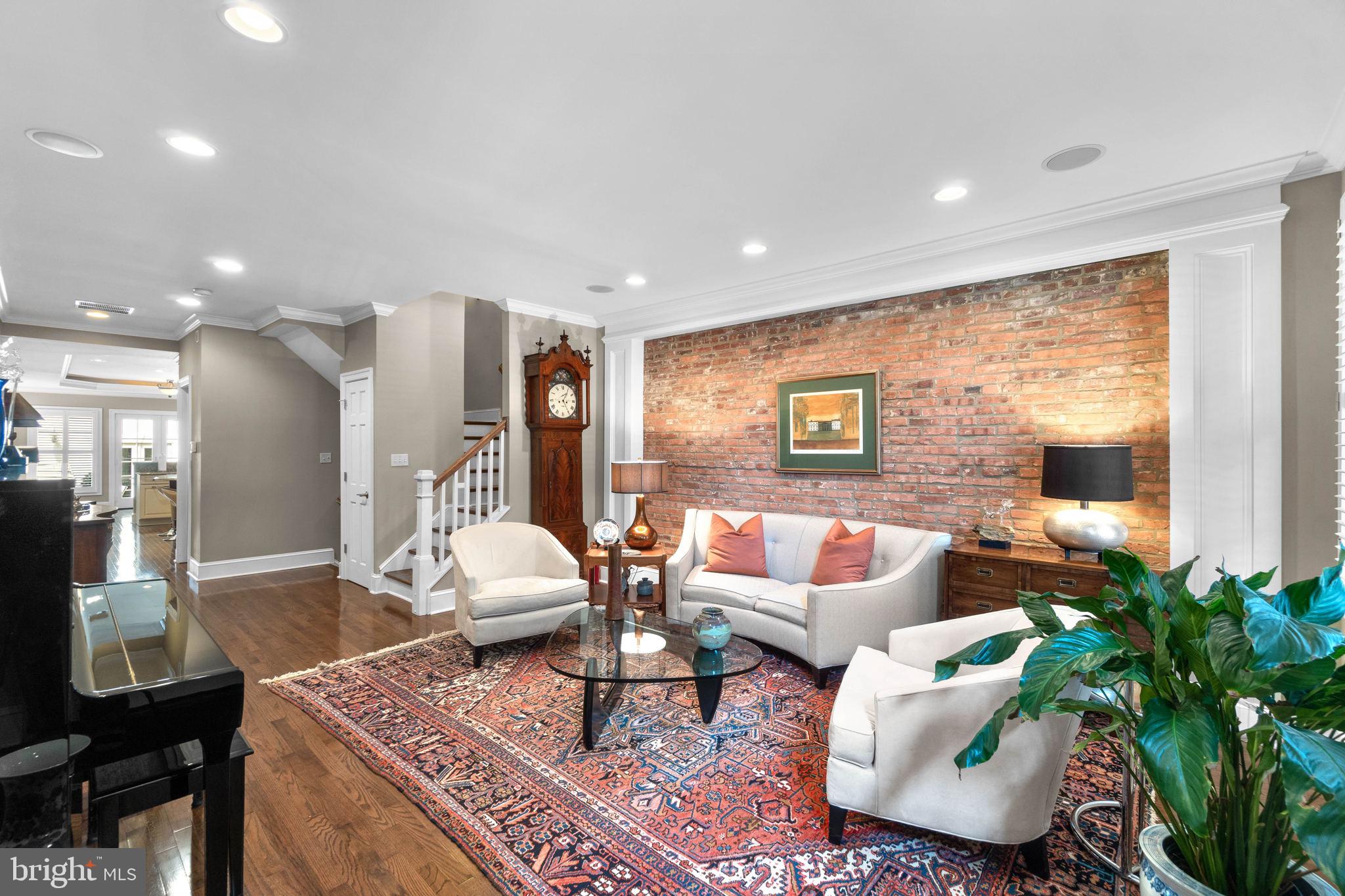 3418 Toone Street Baltimore, MD 21224 - Photo 3 of 51 Main level living room w exposed brick