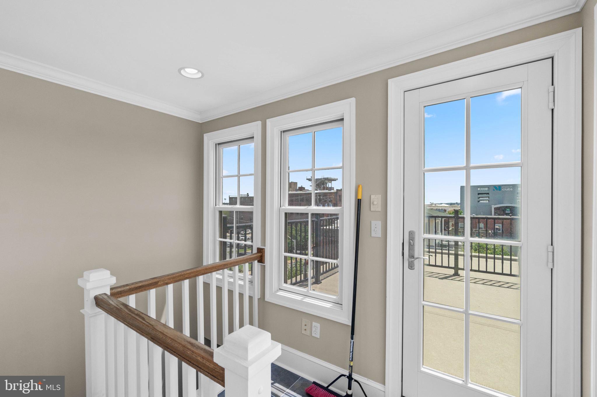3418 Toone Street Baltimore, MD 21224 - Photo 31 of 51 Wide interior stairwell leading to rooftop deck