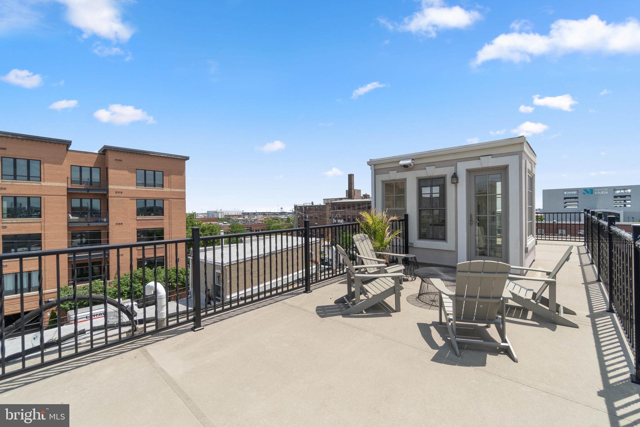 3418 Toone Street Baltimore, MD 21224 - Photo 32 of 51 Rooftop deck w low maintenance coating