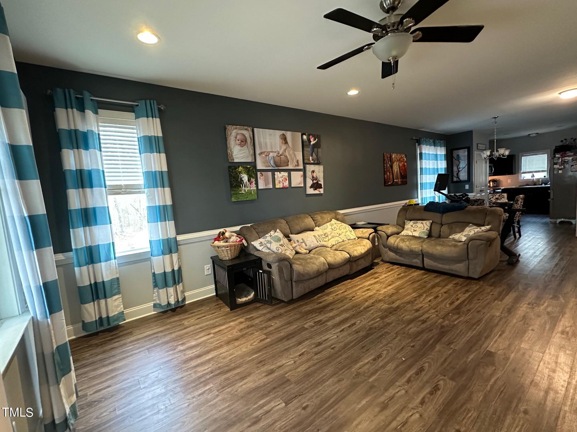 150 Cornerstone Lane Timberlake, NC 27583 - Photo 17 of 38 a spacious bedroom with a bed and a chandelier