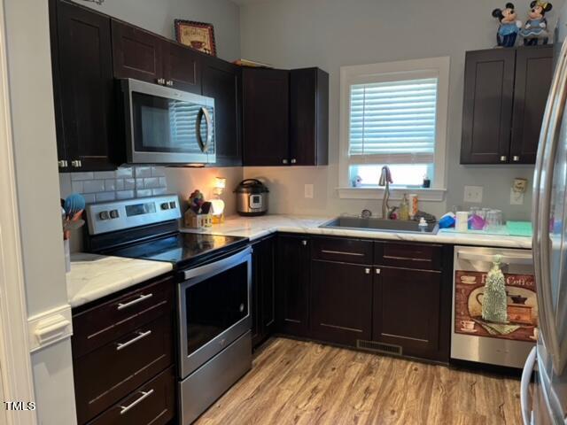 150 Cornerstone Lane Timberlake, NC 27583 - Photo 18 of 38 a kitchen with stainless steel appliances granite countertop a sink stove and microwave