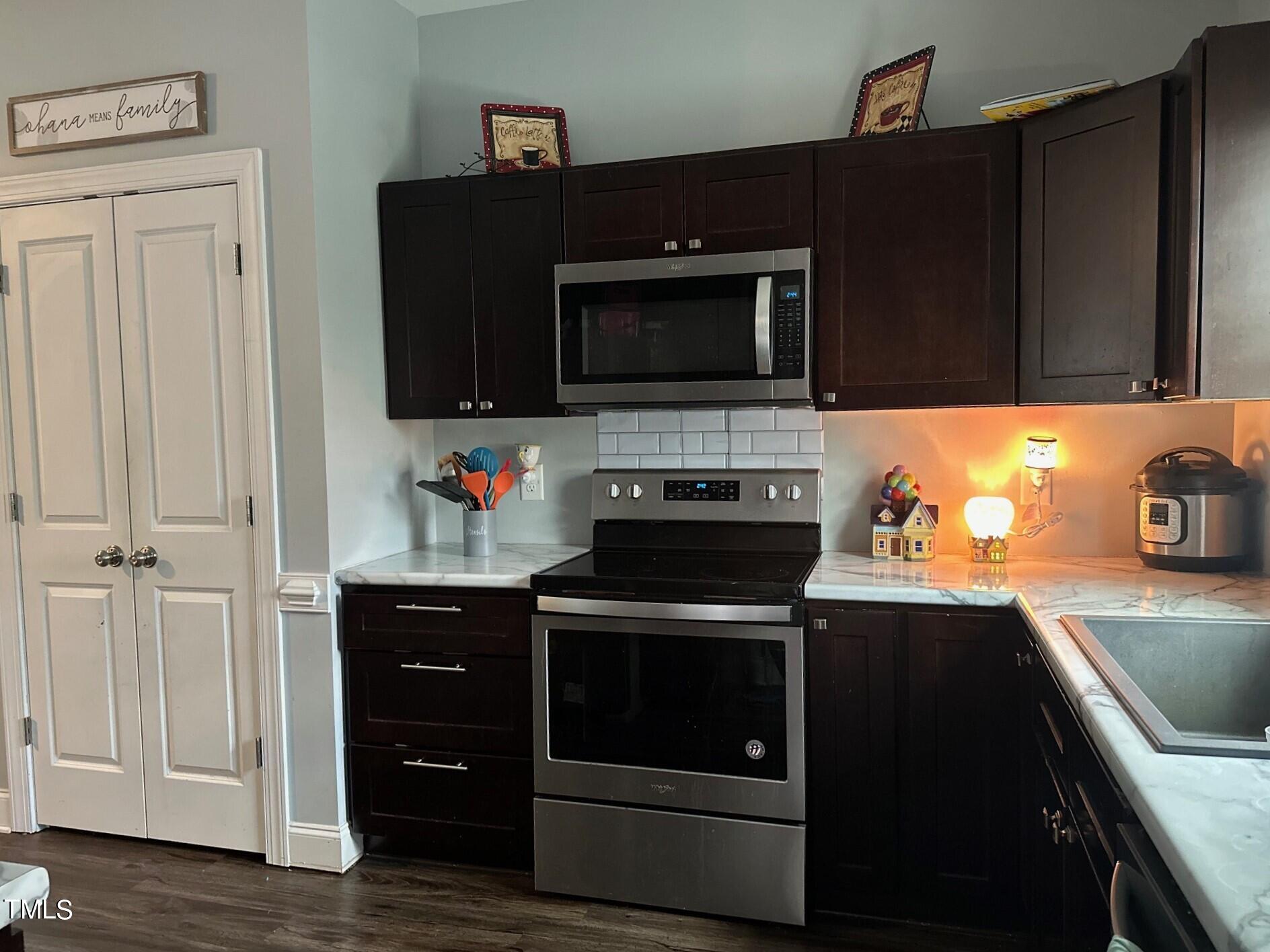 150 Cornerstone Lane Timberlake, NC 27583 - Photo 19 of 38 a kitchen with a stove and a microwave