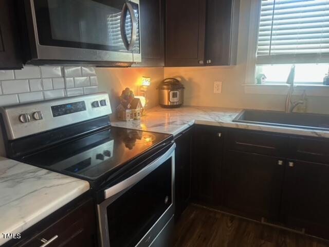150 Cornerstone Lane Timberlake, NC 27583 - Photo 21 of 38 a kitchen with a sink stove and cabinets