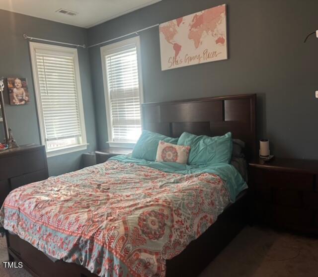 150 Cornerstone Lane Timberlake, NC 27583 - Photo 24 of 38 a bed sitting in a bedroom next to a window