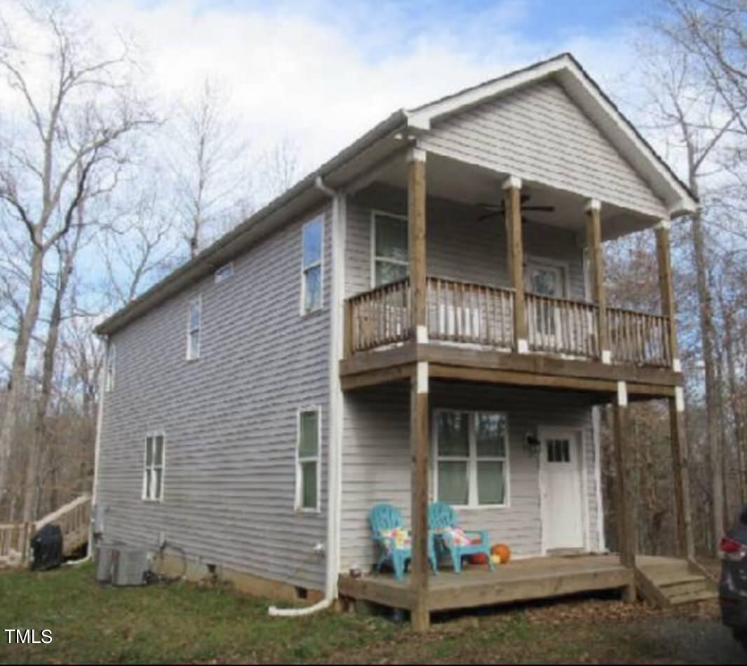 150 Cornerstone Lane Timberlake, NC 27583 - Photo 6 of 38 a front view of a house with garden