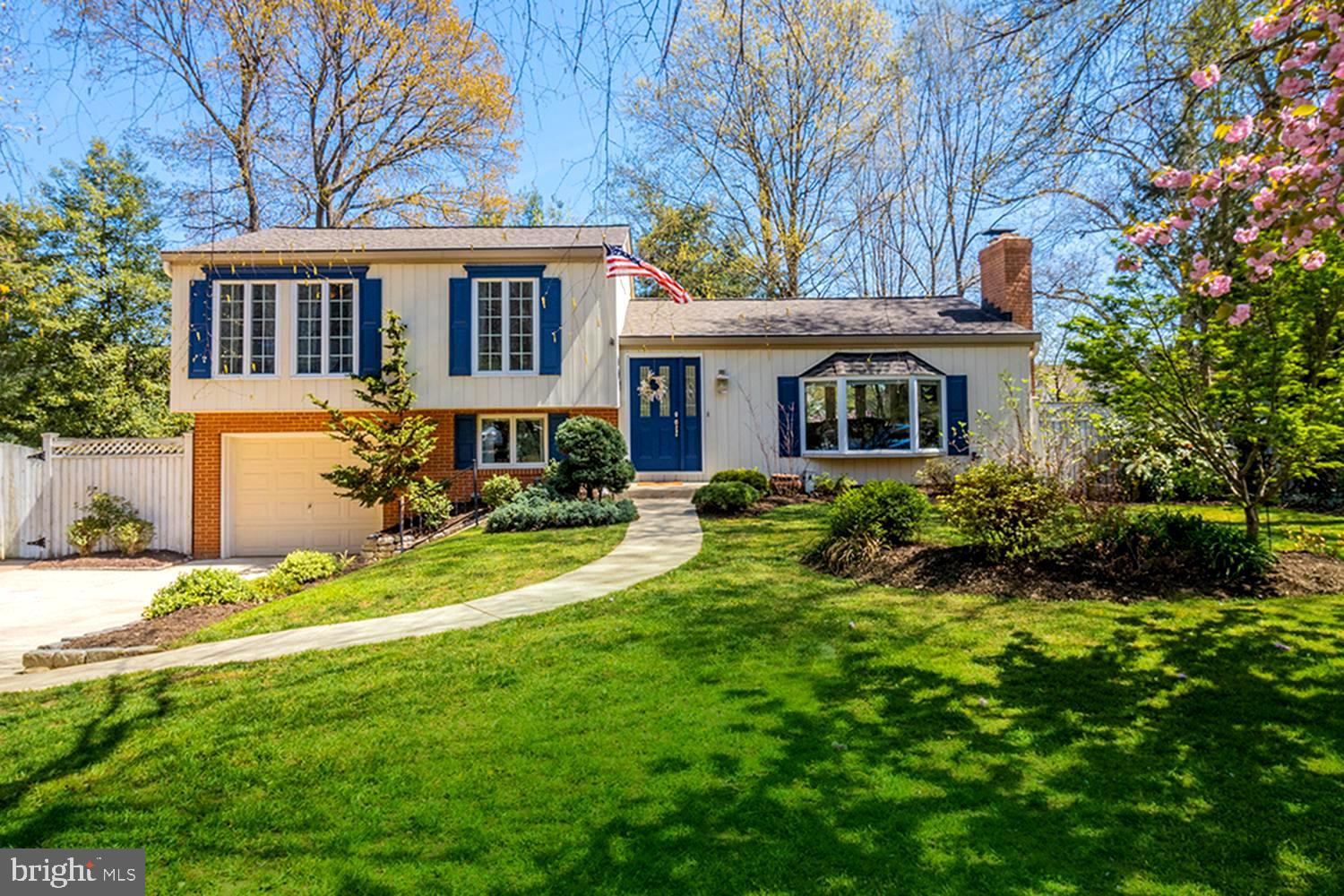 a front view of a house with a yard table and chairs