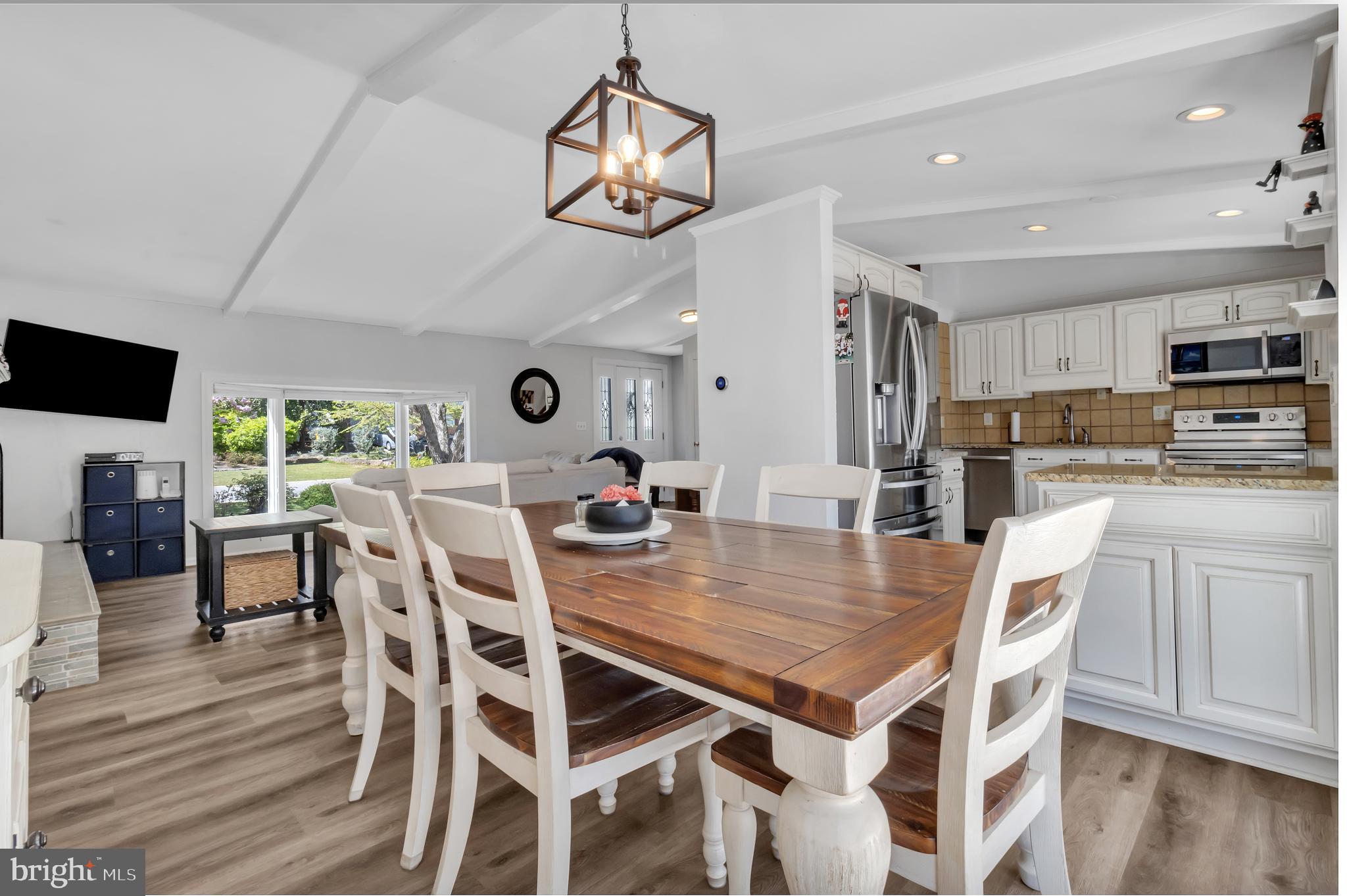 607 Bay Green Drive Arnold, MD 21012 - Photo 15 of 52 a view of a dining room with furniture and wooden floor
