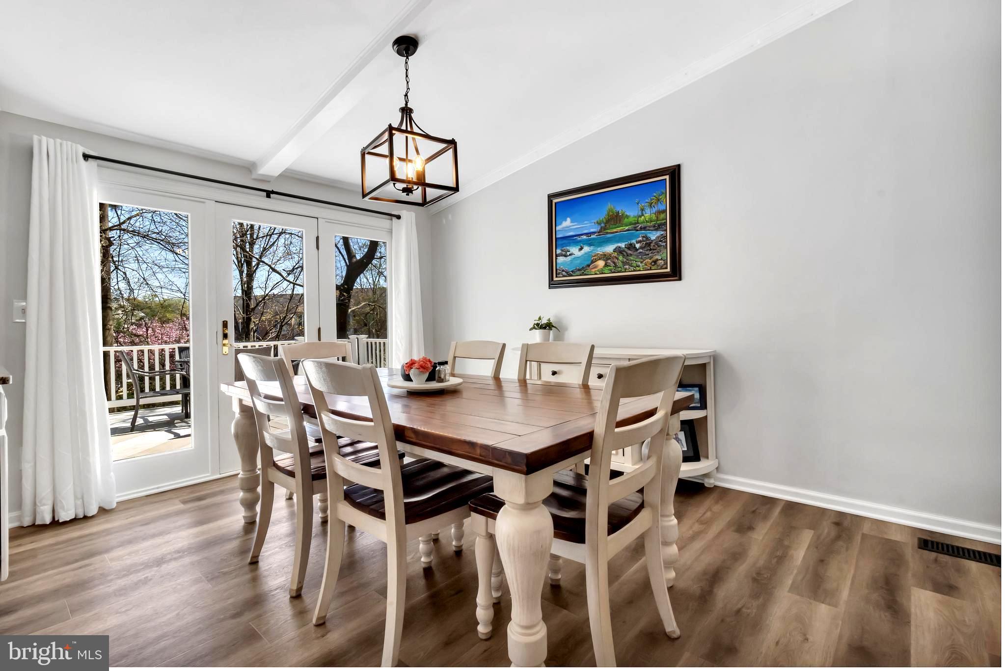 607 Bay Green Drive Arnold, MD 21012 - Photo 17 of 52 a view of a dining room with furniture wooden floor and a chandelier
