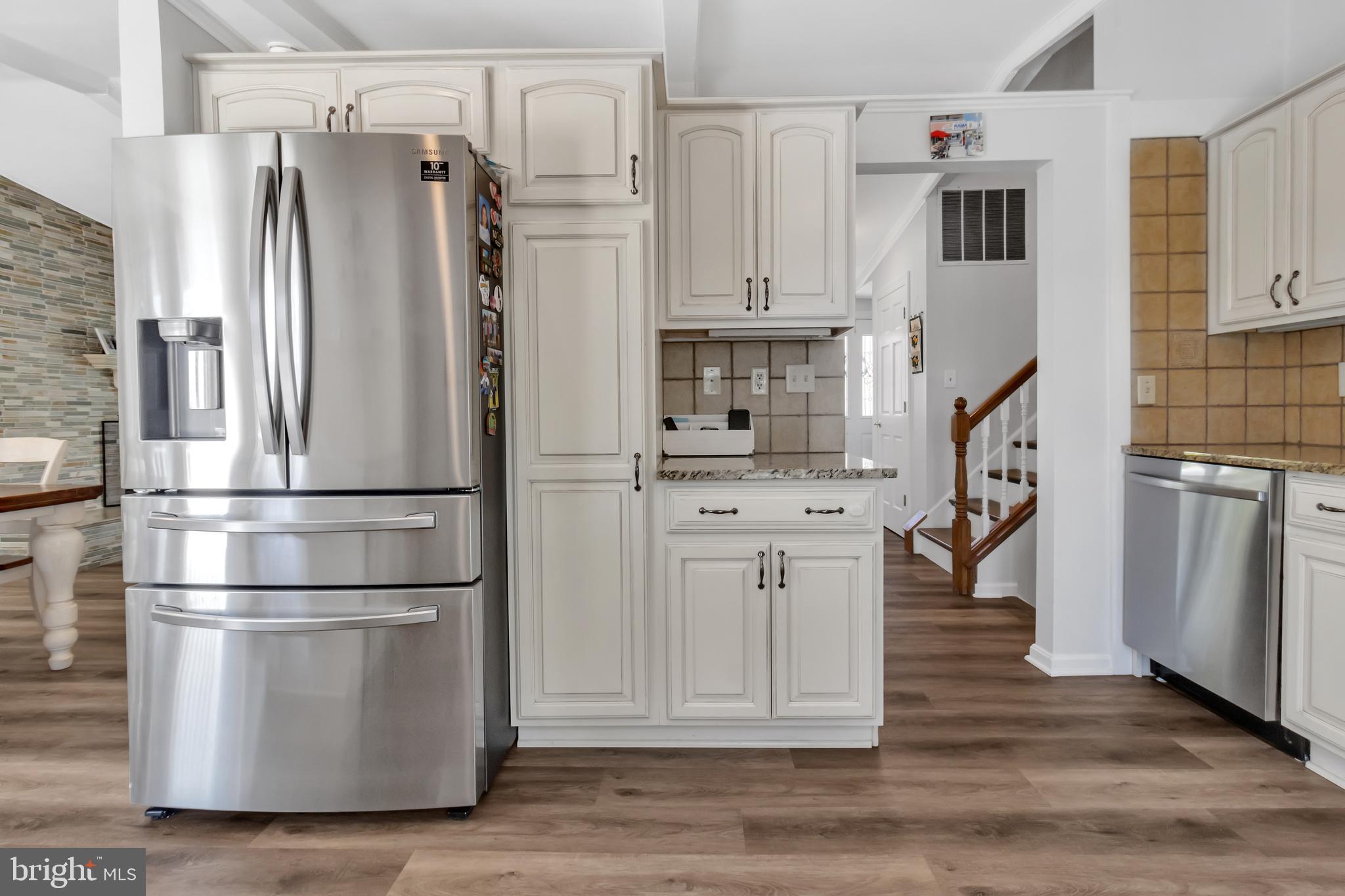 607 Bay Green Drive Arnold, MD 21012 - Photo 22 of 52 a kitchen with stainless steel appliances a refrigerator and cabinets