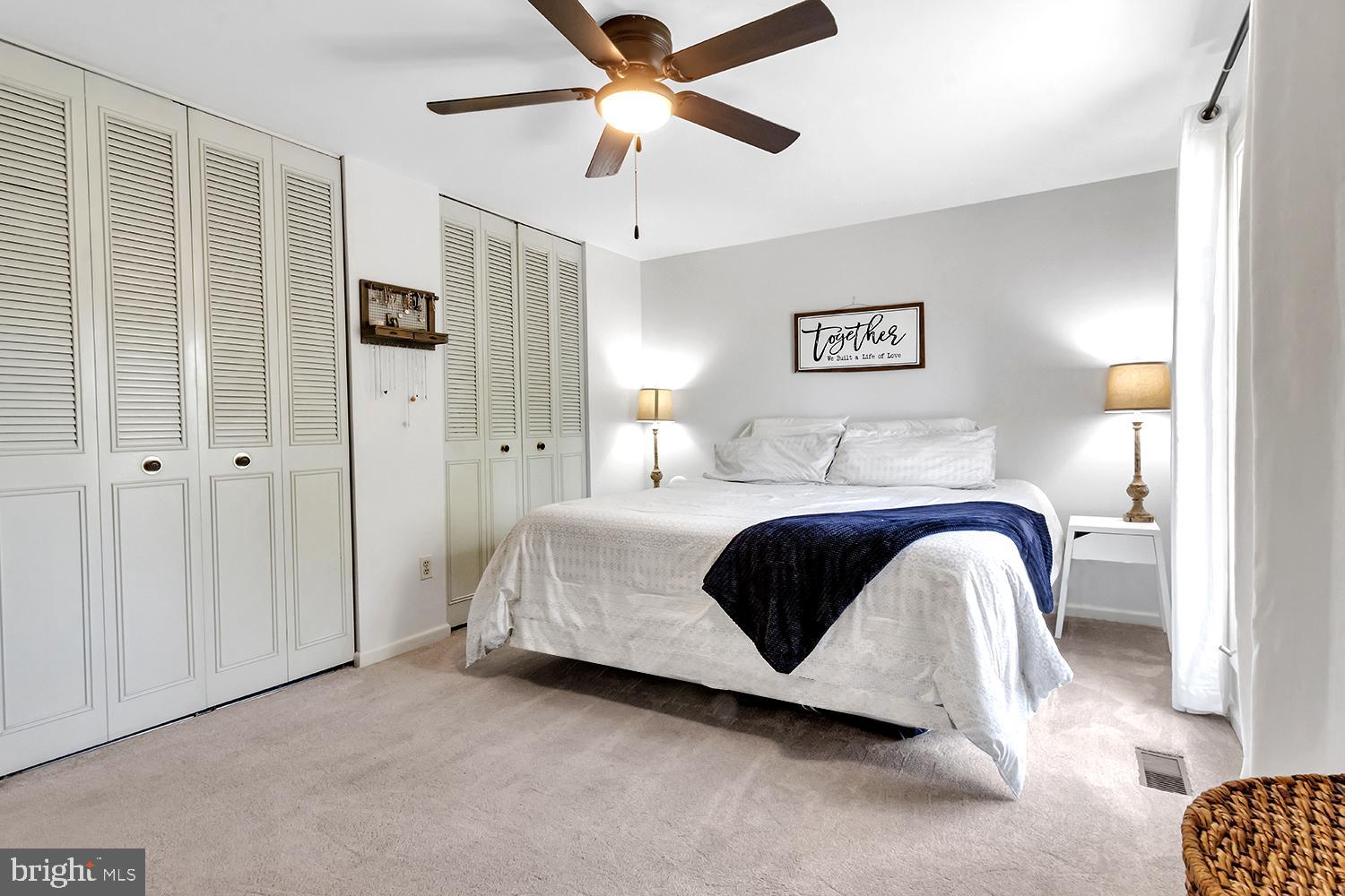 607 Bay Green Drive Arnold, MD 21012 - Photo 28 of 52 a bedroom with a bed and a chandelier