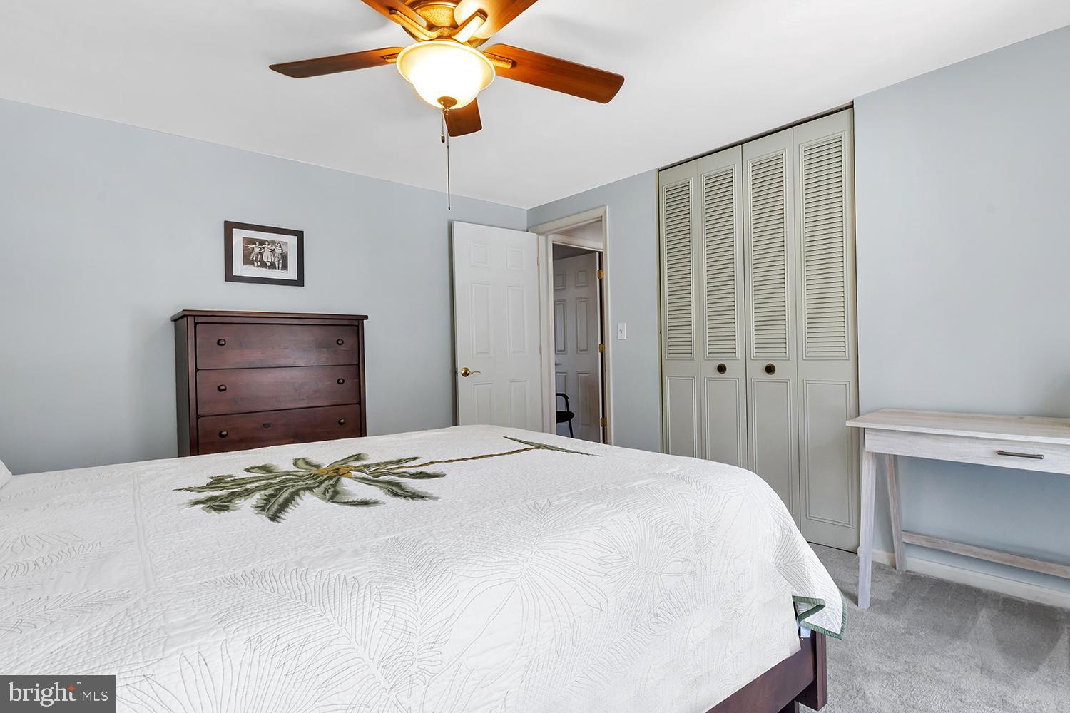 607 Bay Green Drive Arnold, MD 21012 - Photo 33 of 52 a bedroom with a bed and a chandelier