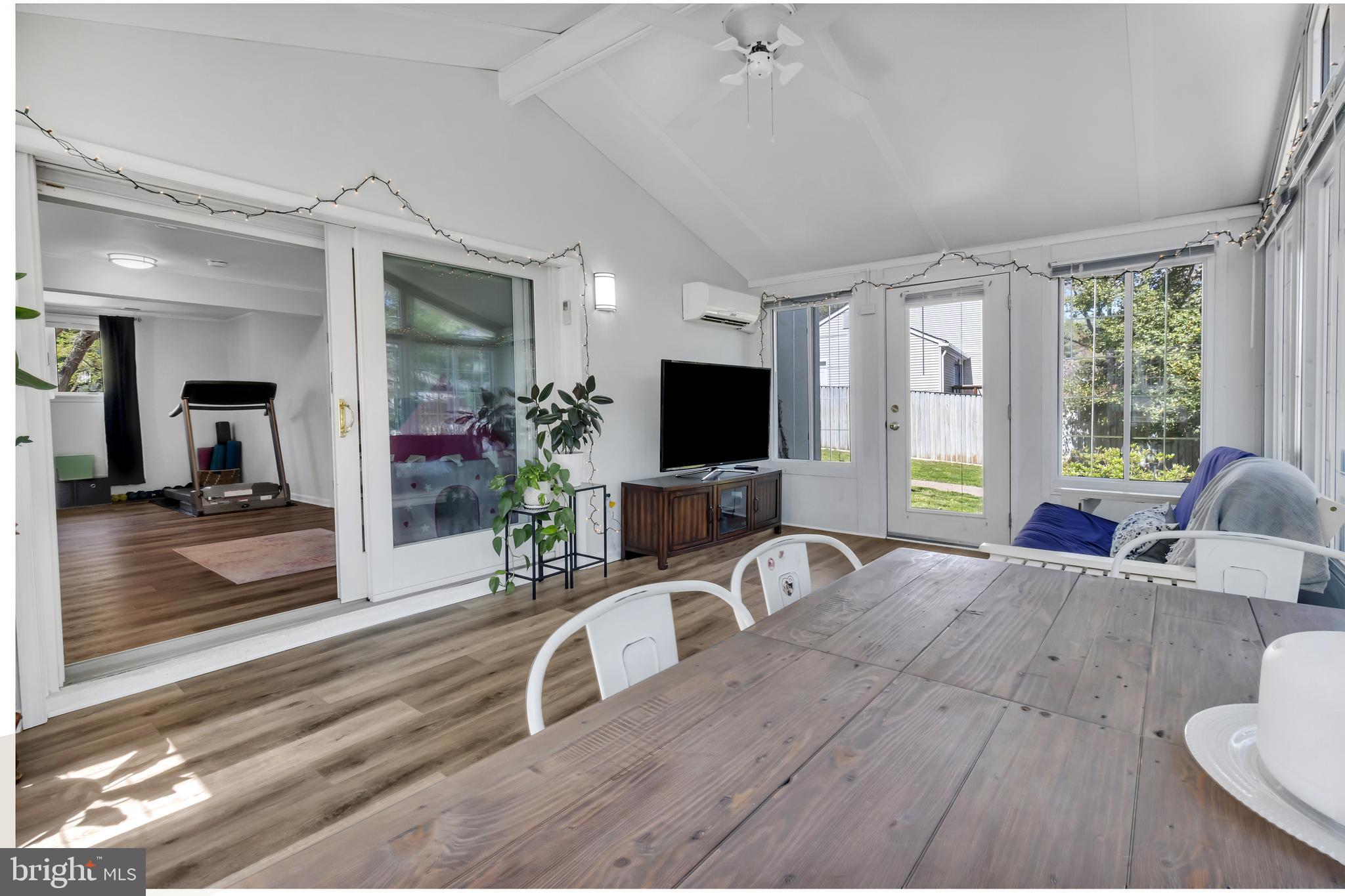 607 Bay Green Drive Arnold, MD 21012 - Photo 40 of 52 a living room with furniture a flat screen tv and a large window