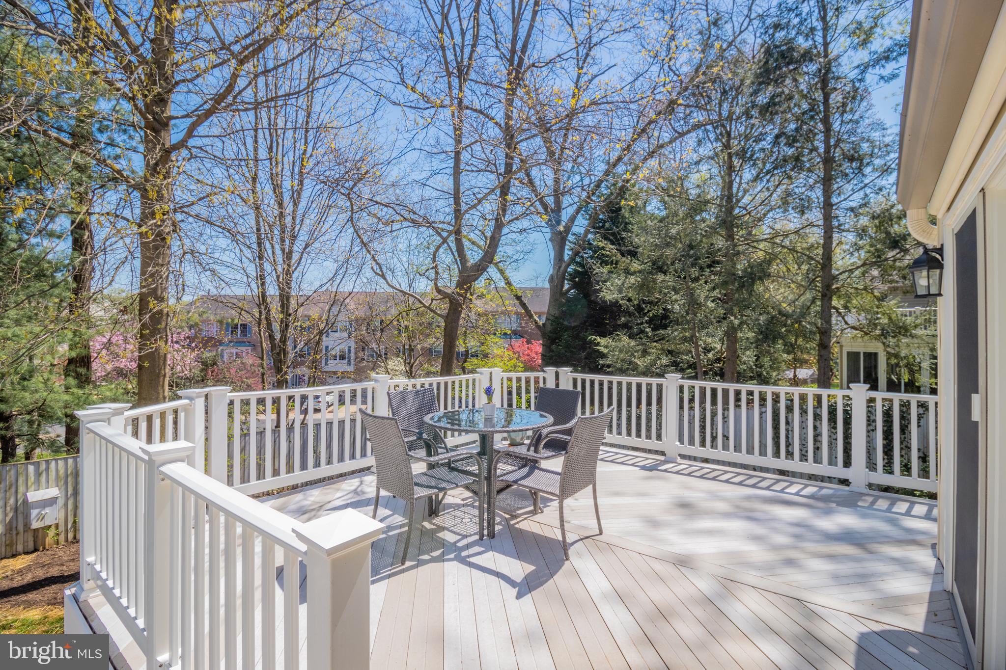 607 Bay Green Drive Arnold, MD 21012 - Photo 4 of 52 a view of a chair and table on the deck