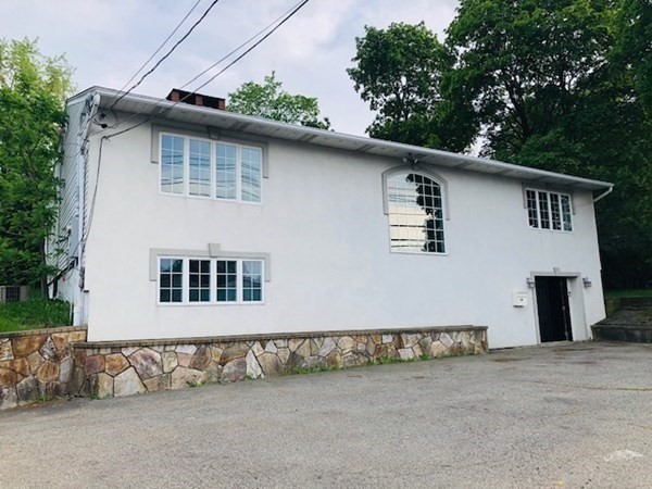 548 Worcester Street Natick, MA 01760 - Photo 1 of 21 a front view of a house with a garage