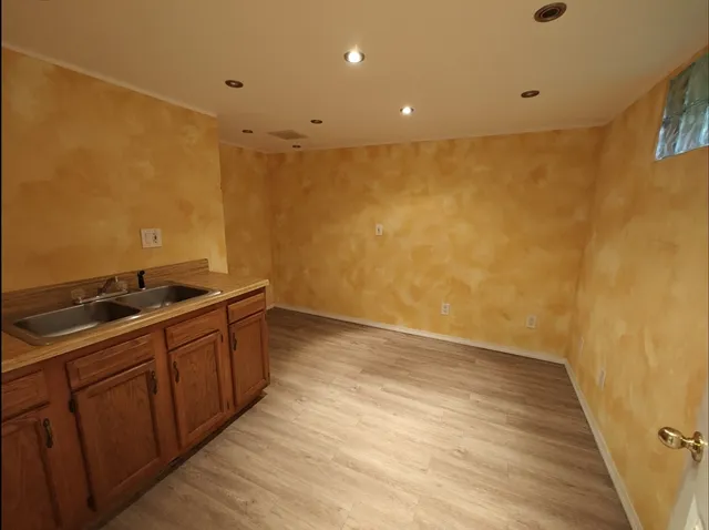 a bathroom with a toilet a sink and shower