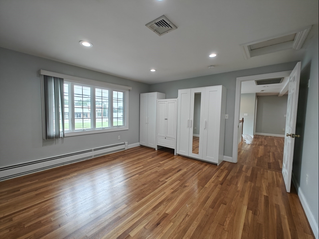 548 Worcester Street Natick, MA 01760 - Photo 17 of 21 a view of livingroom with hardwood floor and hallway