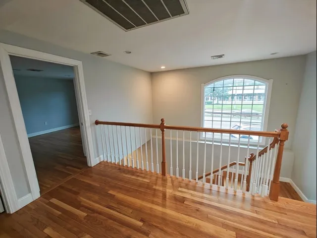 a view of entryway with wooden floor
