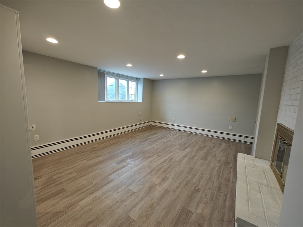 548 Worcester Street Natick, MA 01760 - Photo 9 of 21 wooden floor in an empty room with a window