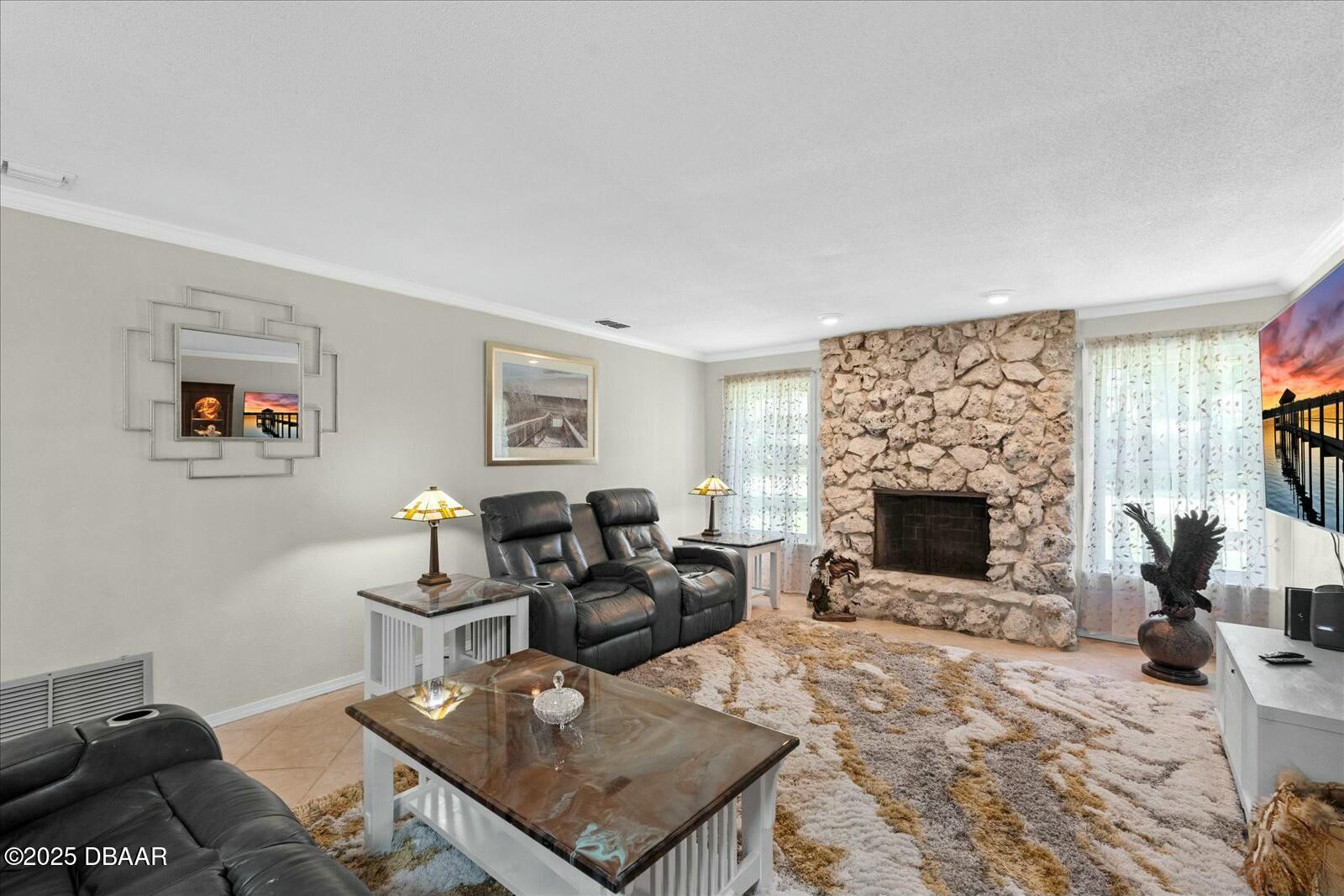 1 Cobblestone Trail Ormond Beach, FL 32174 - Photo 11 of 31 a living room with furniture and a fireplace