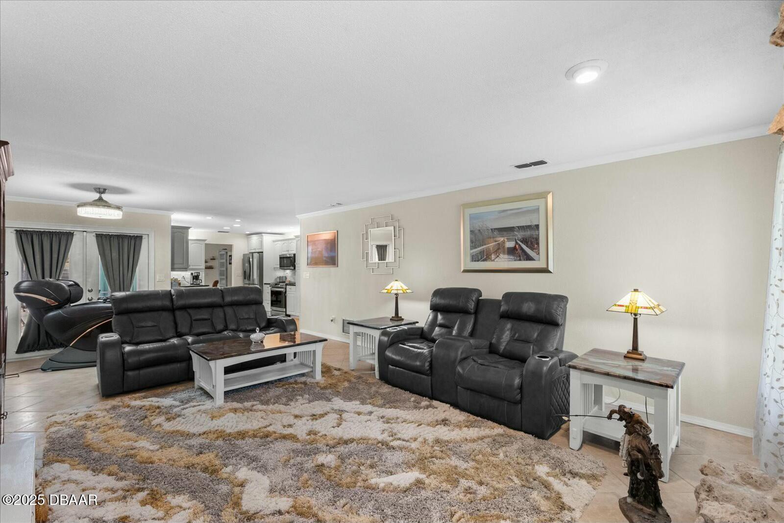1 Cobblestone Trail Ormond Beach, FL 32174 - Photo 12 of 31 a living room with furniture a lamp and a lamp