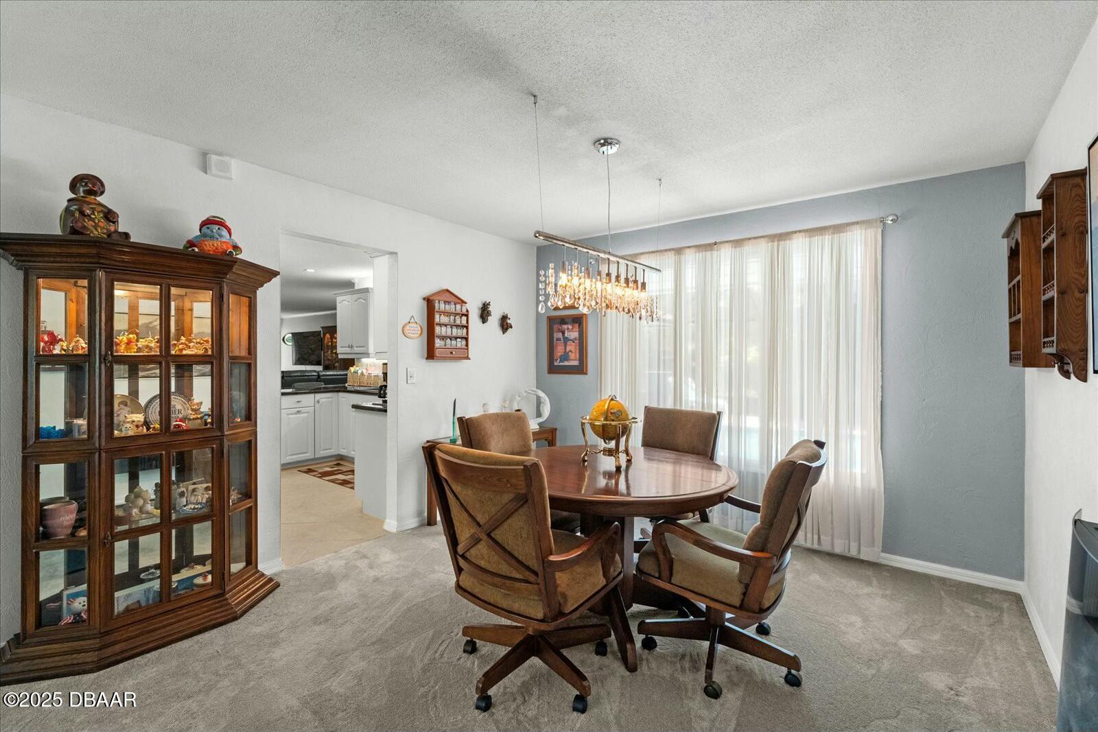 1 Cobblestone Trail Ormond Beach, FL 32174 - Photo 20 of 31 a view of a dining room with furniture and a window