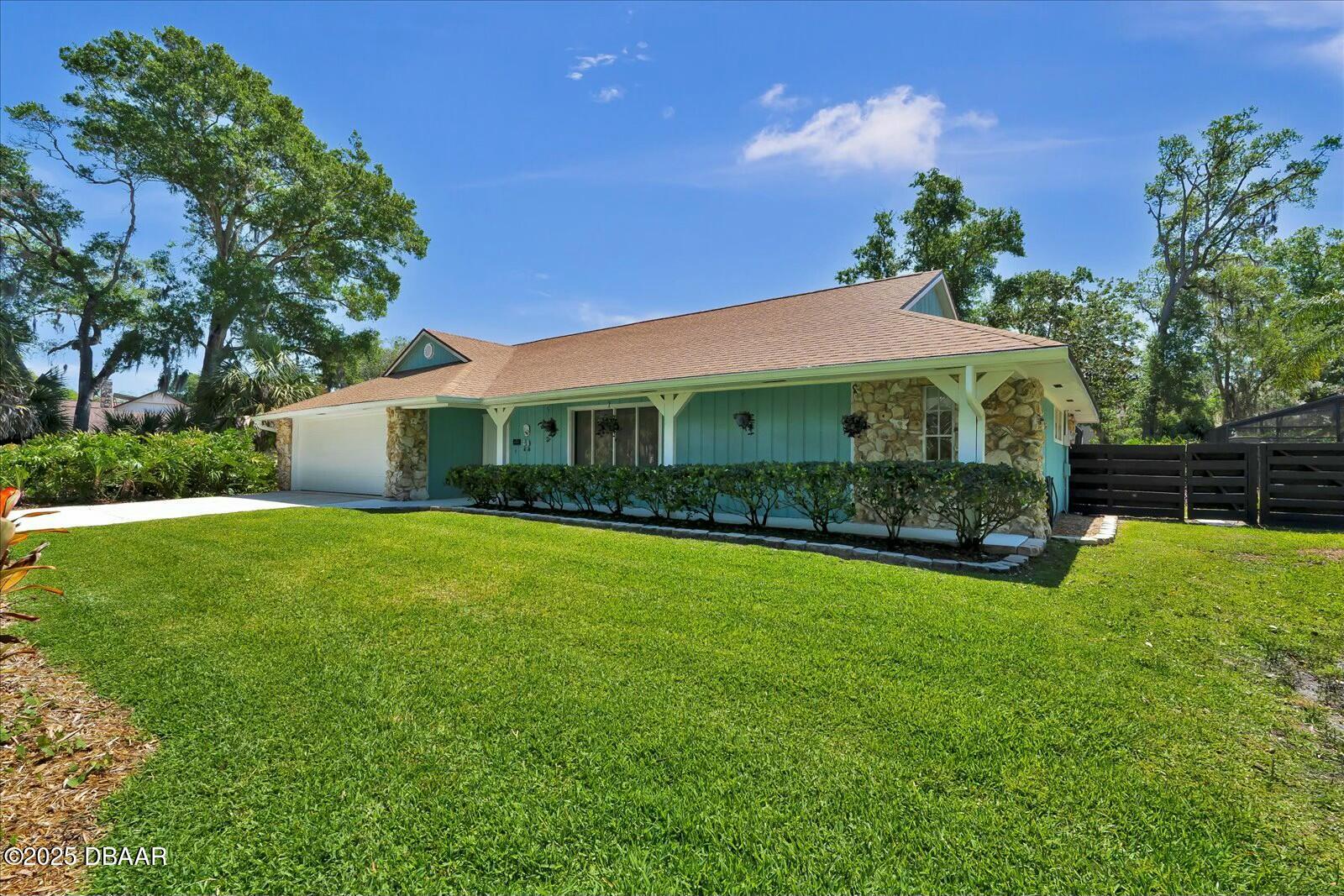 1 Cobblestone Trail Ormond Beach, FL 32174 - Photo 2 of 31 a view of house with garden and street