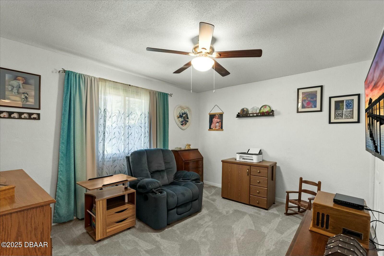1 Cobblestone Trail Ormond Beach, FL 32174 - Photo 25 of 31 a living room with furniture and a window