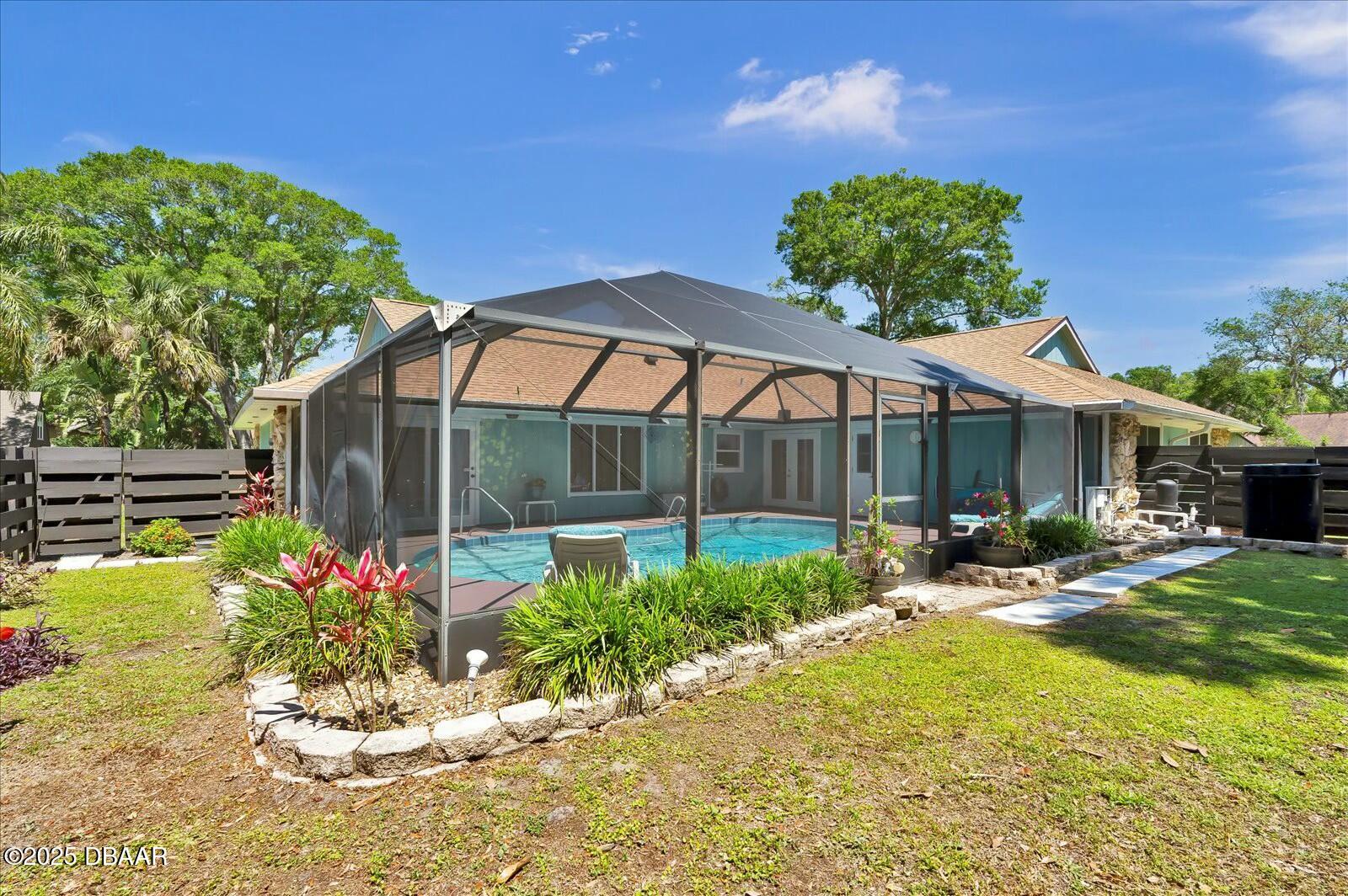1 Cobblestone Trail Ormond Beach, FL 32174 - Photo 29 of 31 a front view of a house with garden