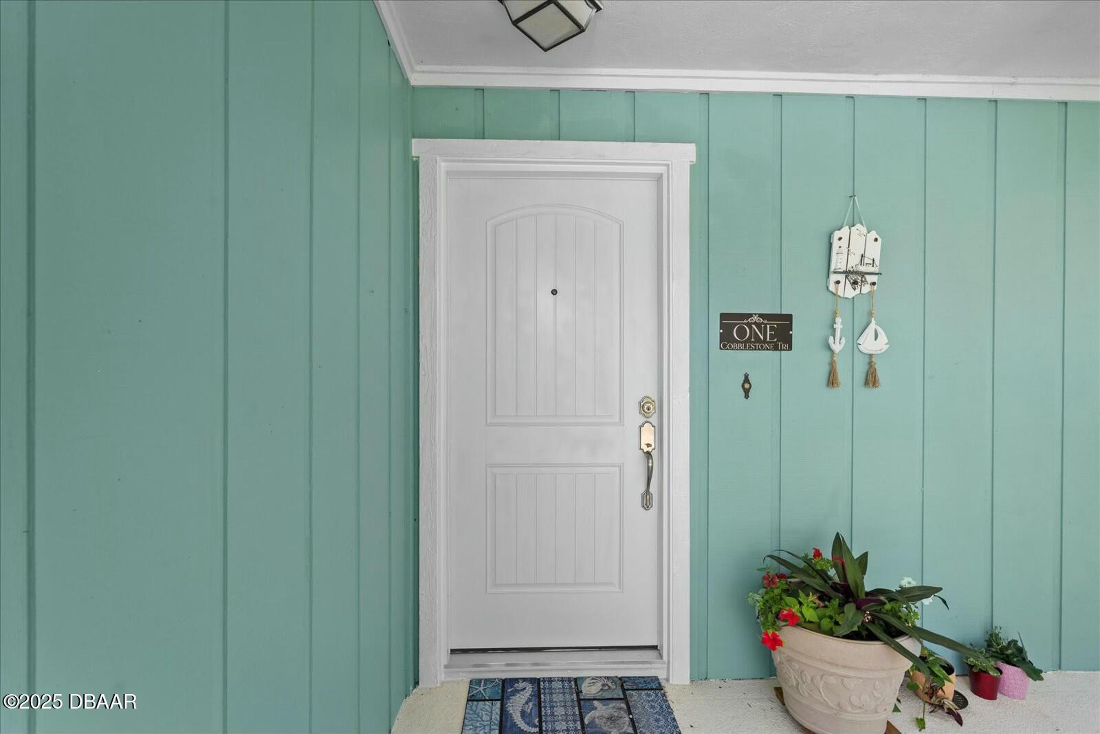 1 Cobblestone Trail Ormond Beach, FL 32174 - Photo 4 of 31 a view of a hallway with potted plant