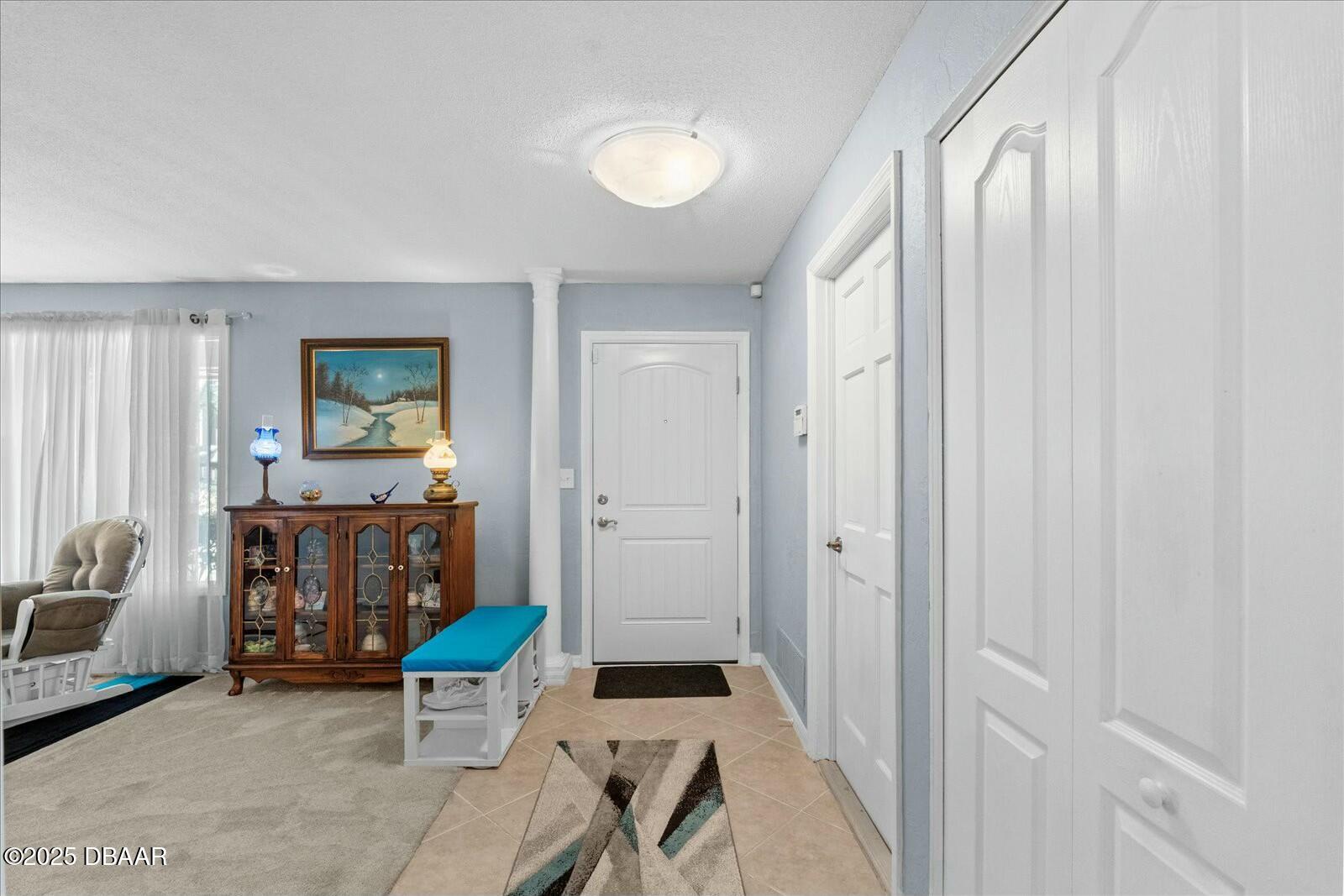1 Cobblestone Trail Ormond Beach, FL 32174 - Photo 5 of 31 a living room with furniture and a window