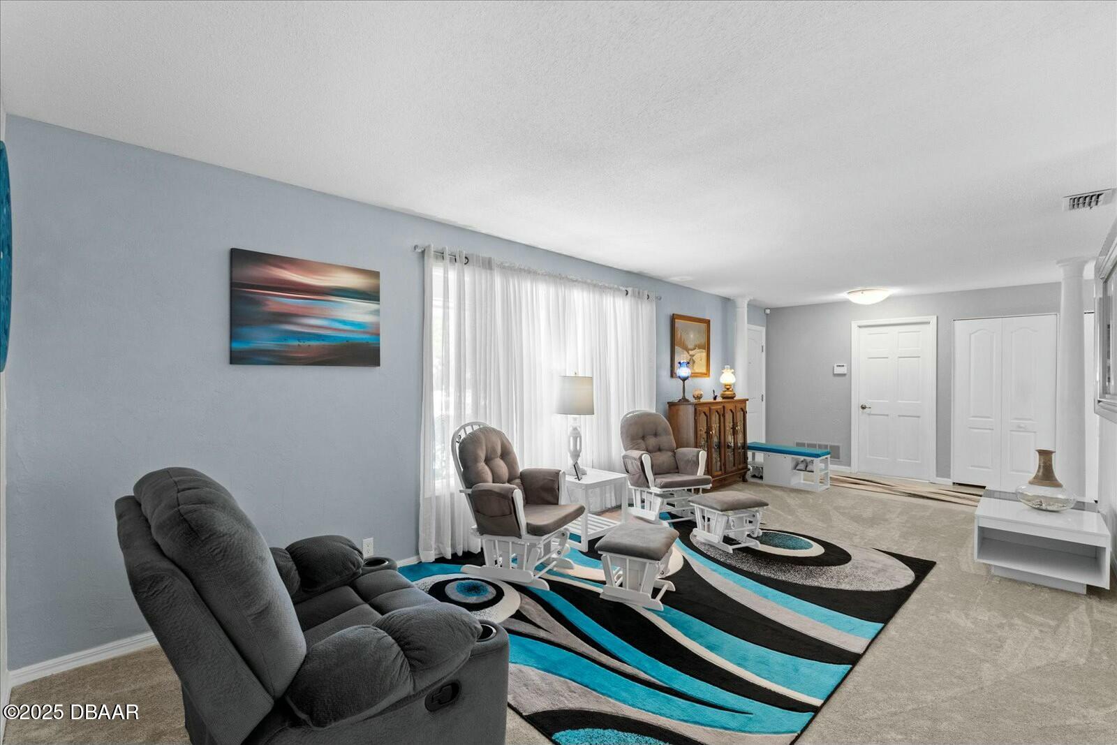 1 Cobblestone Trail Ormond Beach, FL 32174 - Photo 8 of 31 a living room with furniture and wooden floor